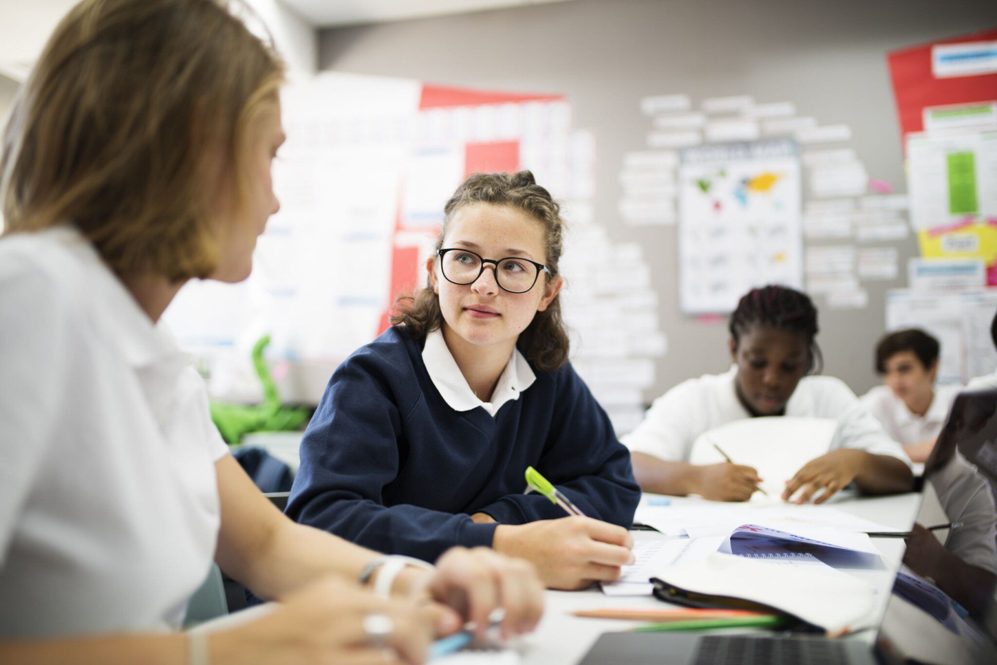 Students talking about needs for functional skills in a uk classroom.